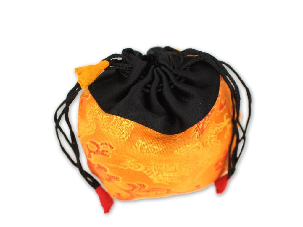 Beispielinhalt (Bild) Kleine Klangschale mit hellem Klang in gelbem Beutel