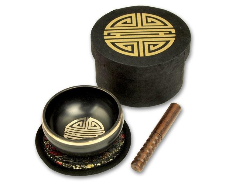 Beispielinhalt (Bild) Kleine schwarze Klangschalen in schwarzer, runder Box mit Longevity-Aufdruck