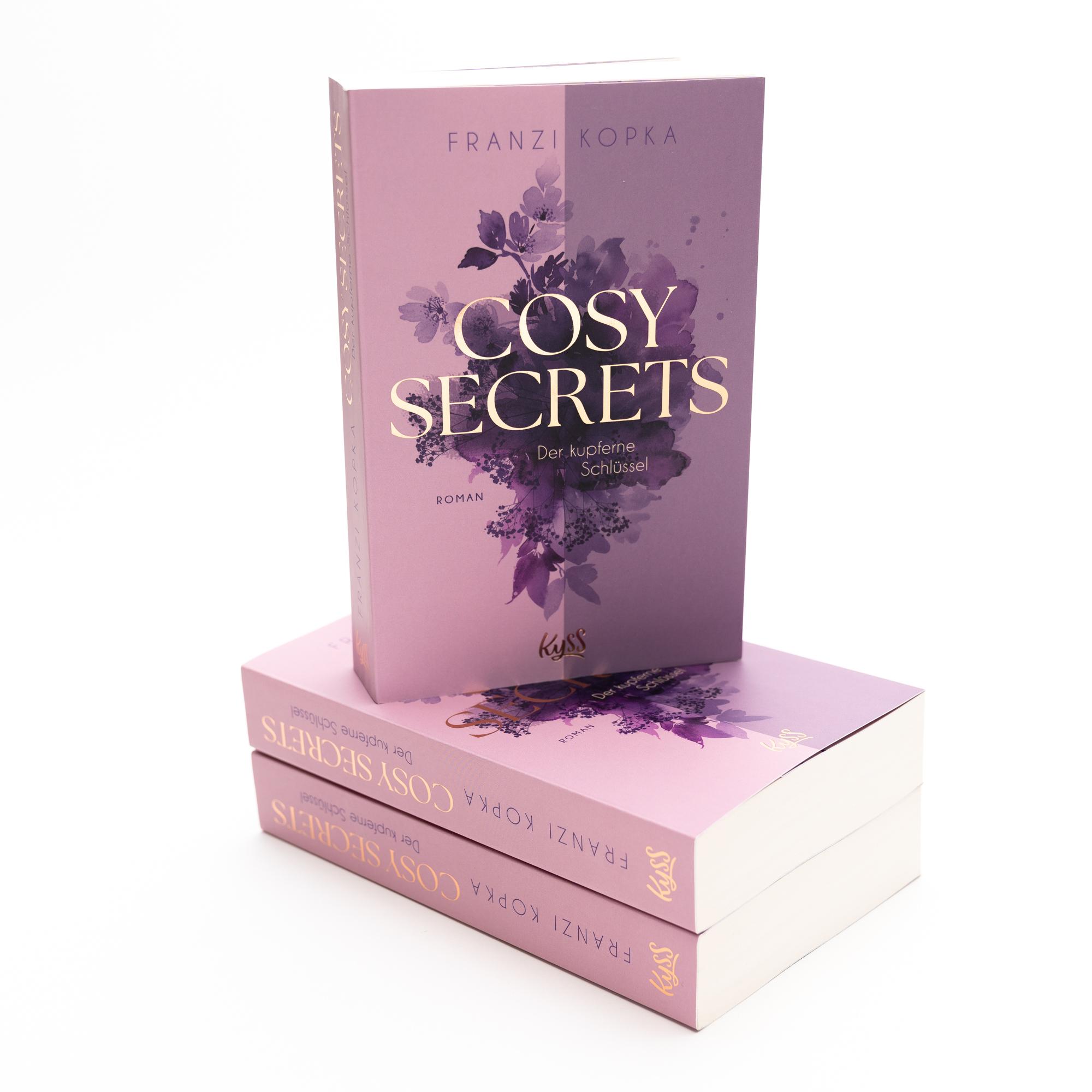 Beispielinhalt (Bild) Cosy Secrets - Ein kleiner Ort. Ein großes Geheimnis. Und eine zweite Chance für die Liebe.